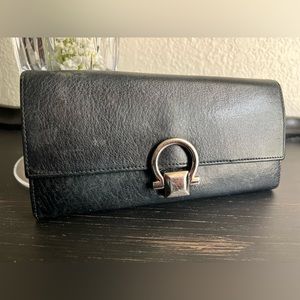 Salvatore Ferragamo Black leather long wallet.